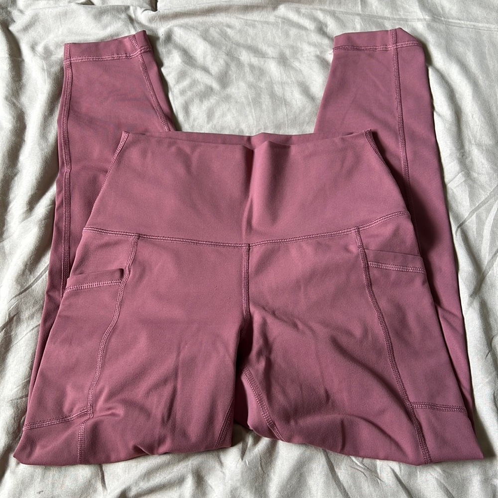 Pink athletic leggings with pockets